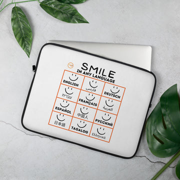WE ALL SMILE IN THE SAME LANGUAGE - LAPTOP SLEEVE WHITE
